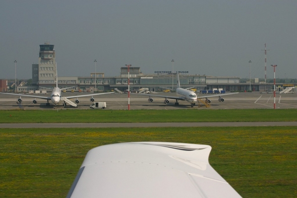 Ostend
Taking-off RWY 26, ZS-OZV and ST-UAA on the ramp...

